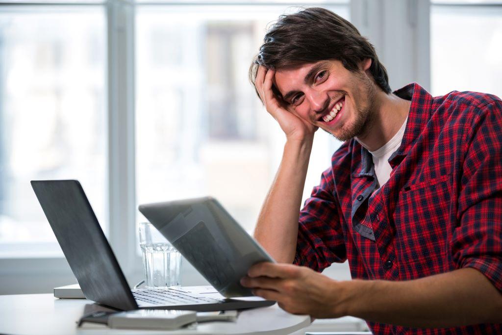 A boy is happy after recalling the email sent to the wrong person